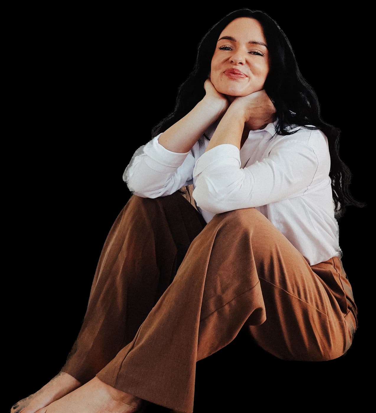 Nikki Isaacson sitting with her hands tucked under her chin